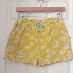 Boden girl’s yellow tropical/jungle ruffle shorts
